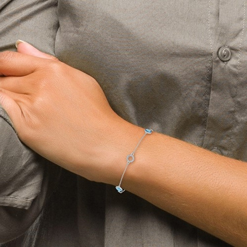 Elegant White Sterling Silver Rhodium-plated Blue Topaz and Diamond Bracelet