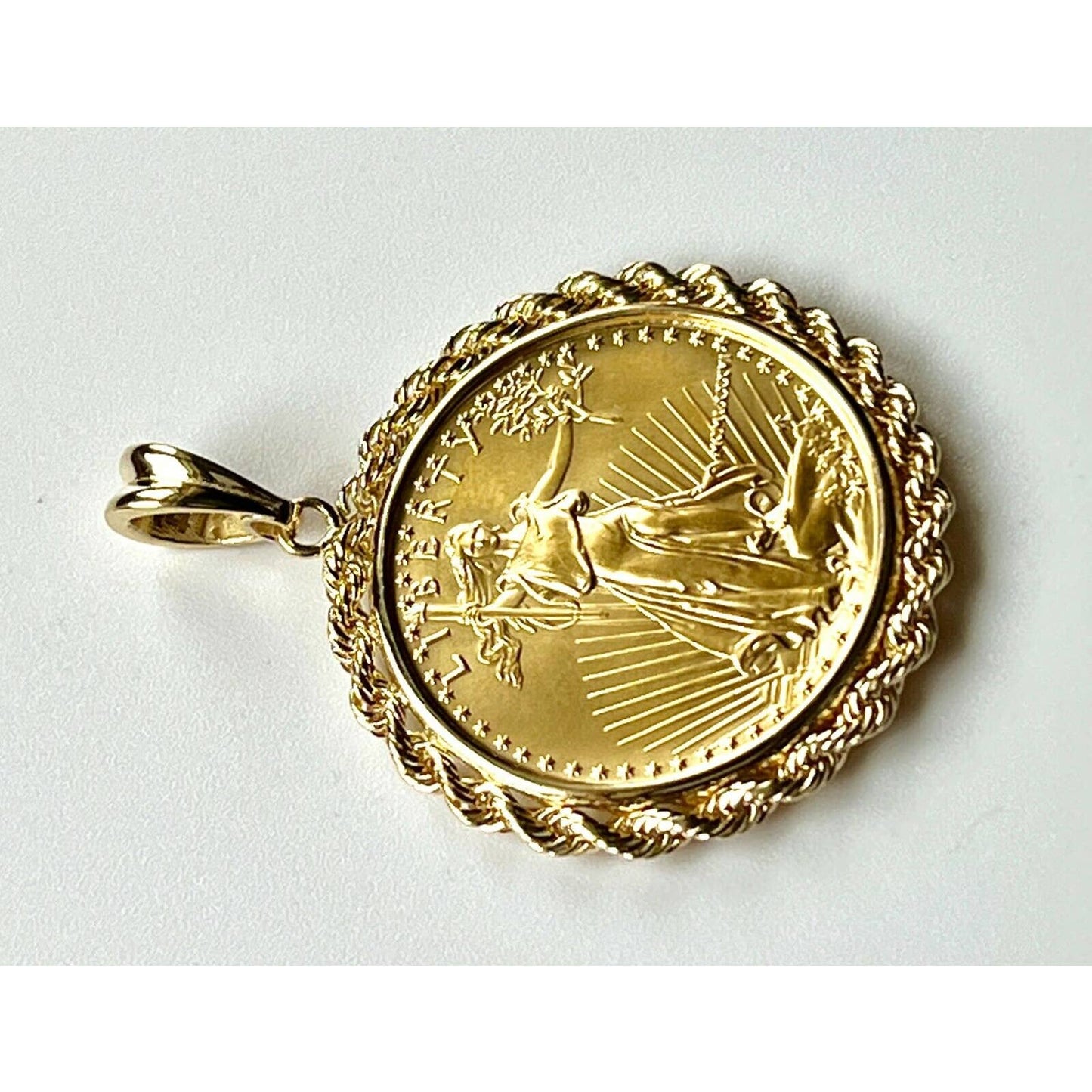22k gold American Eagle 1/2 ounce coin mounted in 14k gold coin bezel