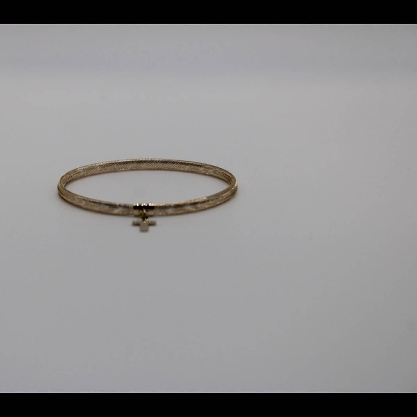 10k gold stretch mesh bracelet with cross charm