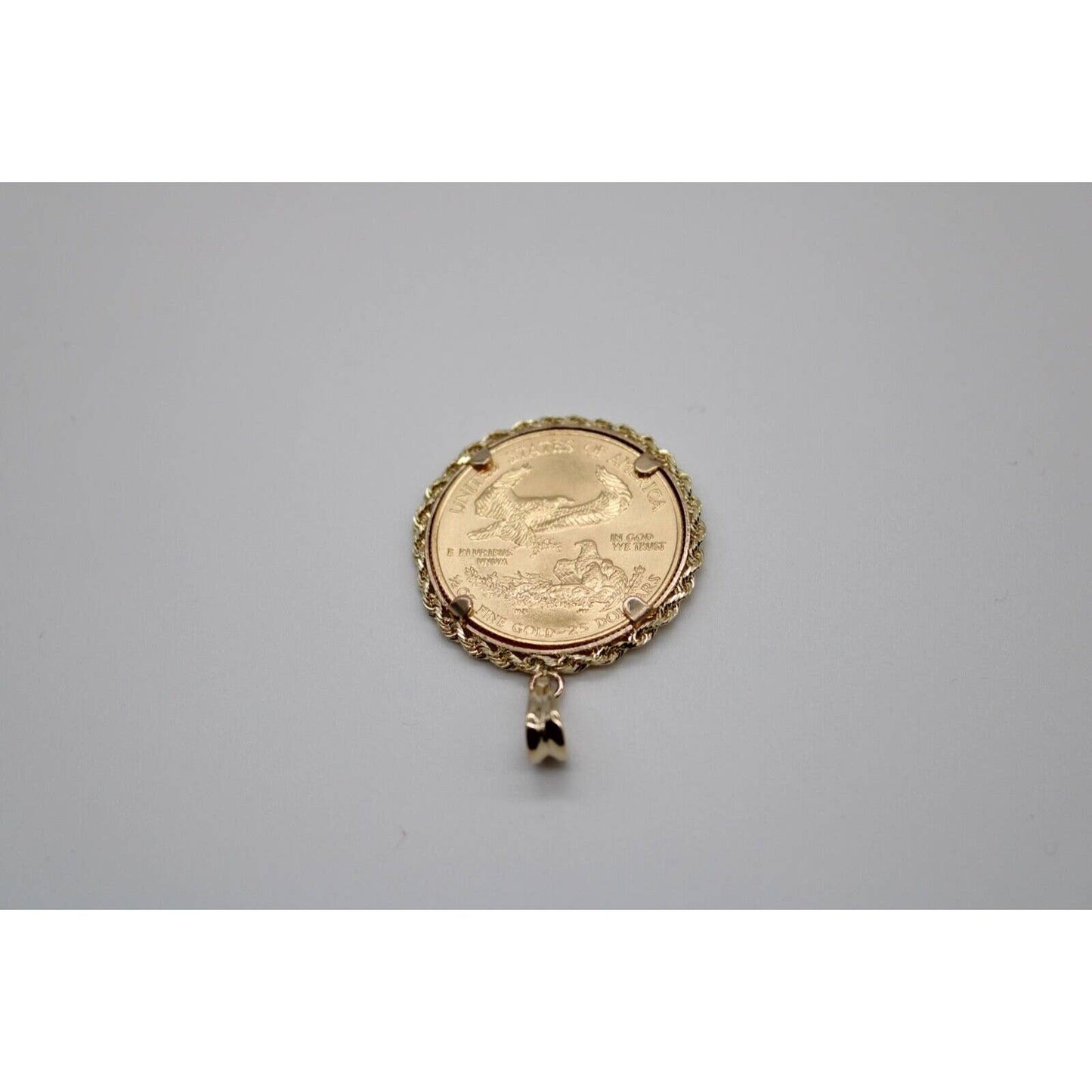 22k gold American Eagle 1/2 ounce coin mounted in 14k gold coin bezel