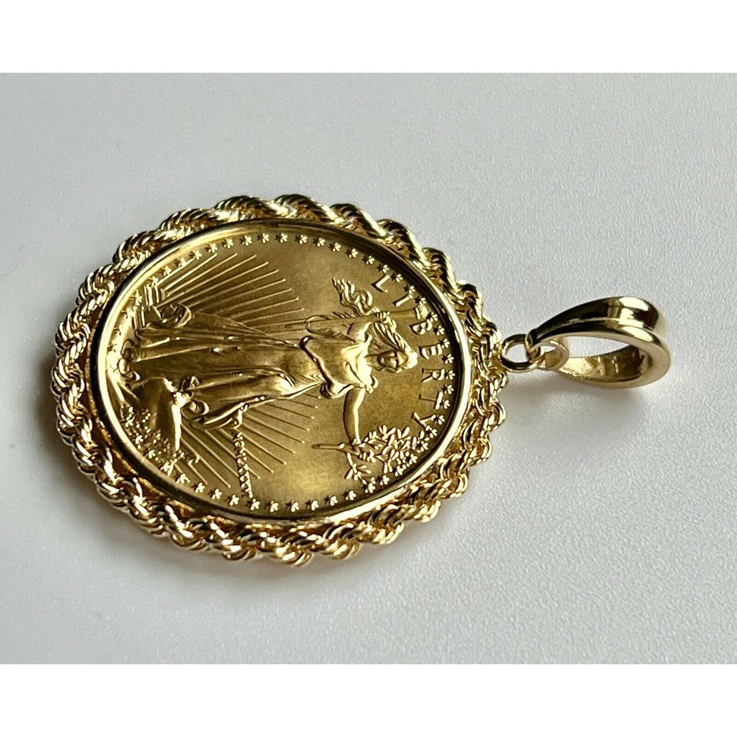 22k gold American Eagle 1/2 ounce coin mounted in 14k gold coin bezel