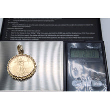 Load image into Gallery viewer, 22k gold American Eagle 1/2 ounce coin mounted in 14k gold coin bezel
